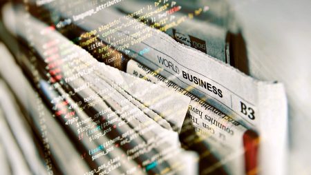 Newspapers with code overlaying the image