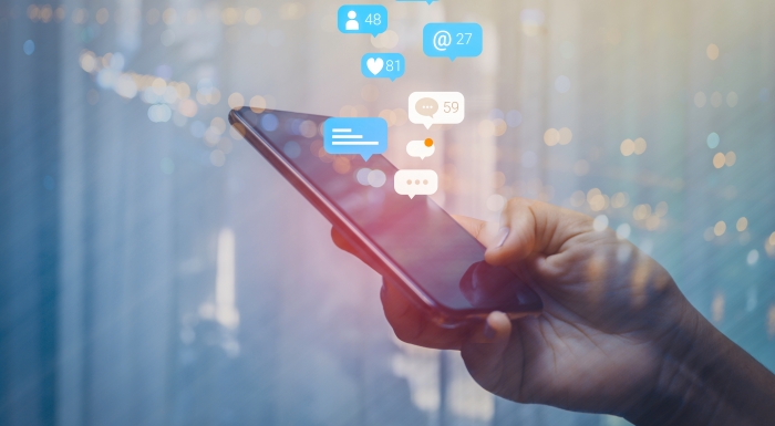Social media icons coming from a mobile phone