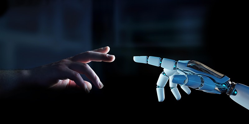 human and robot hands touching
