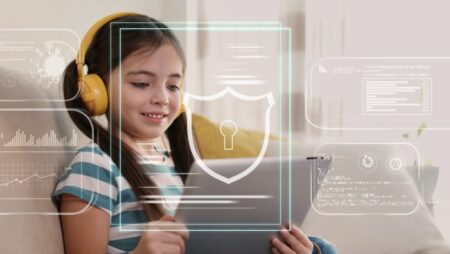 Little girl using tablet at home. Illustration of internet blocking app on foreground