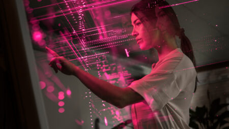 Young scientist examining and using screen of AI technology
